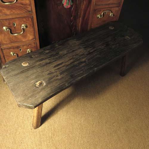 Bog oak stool in the style of a small pig bench
