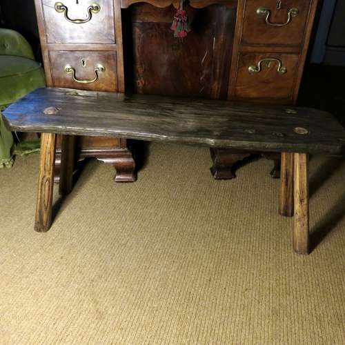 Bog oak stool in the style of a small pig bench