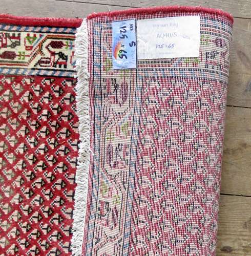 Small handknotted Persian rug