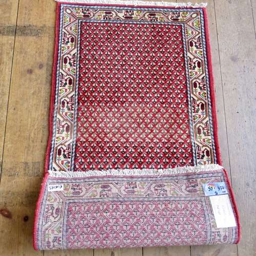 Small handknotted Persian rug