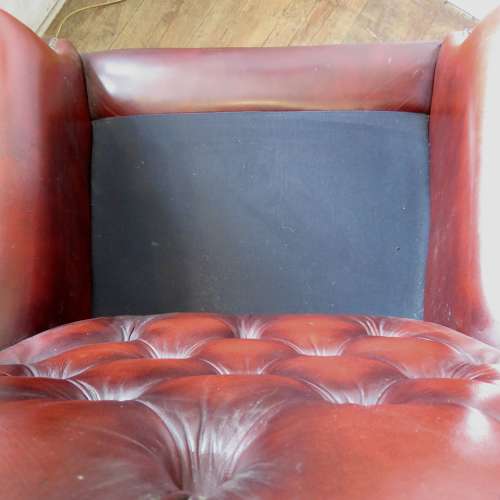 George III style ox-blood red leather wingback armchair