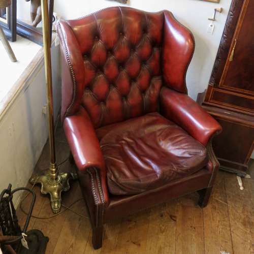 George III style ox-blood red leather wingback armchair