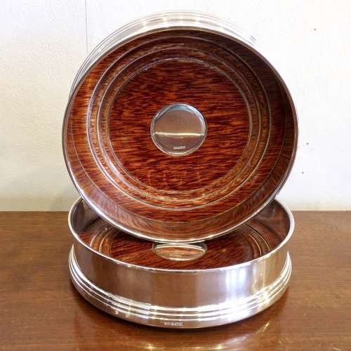 Pair of silver bottle coasters, in their boxes