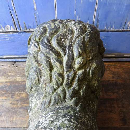 Stone (reconstituted) Lion lying with a ball