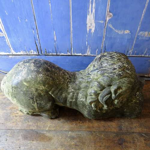 Stone (reconstituted) Lion lying with a ball